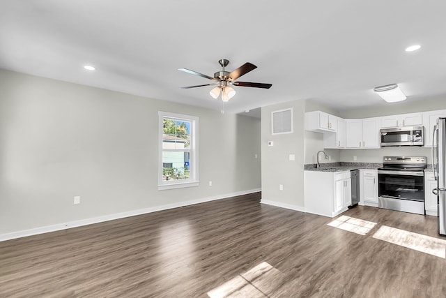 2711 Henry St, North Charleston, SC 29405 - kitchen featuring stainless steel appliances, open floor plan, a sink, dark wood finished floors, and recessed lighting