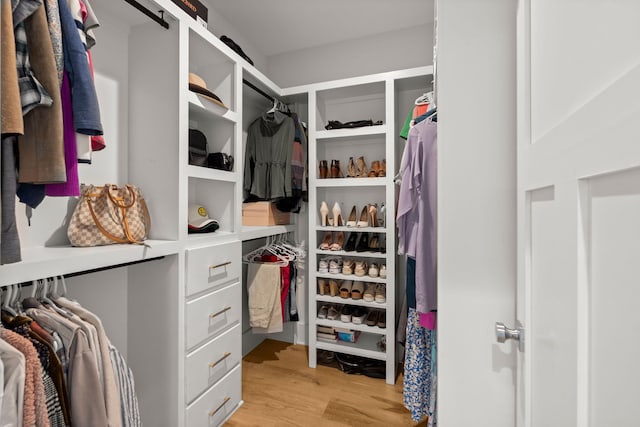 walk in closet featuring light hardwood / wood-style flooring