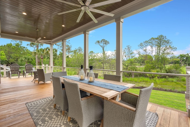 wooden deck featuring ceiling fan