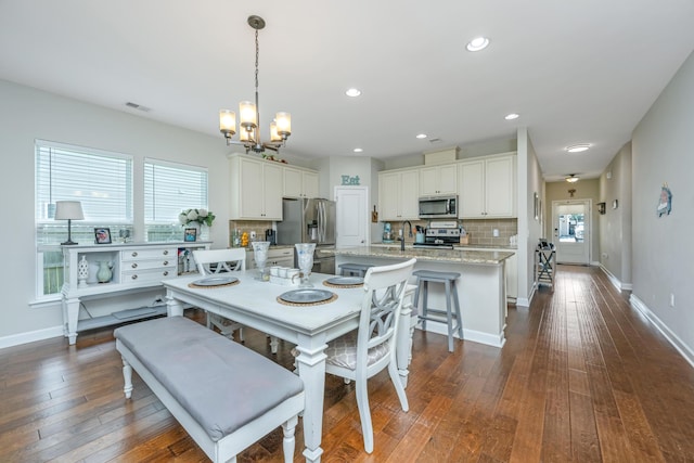 513 Abigail St, Moncks Corner, SC 29461 - dining area with visible vents, recessed lighting, dark wood finished floors, an inviting chandelier, and baseboards
