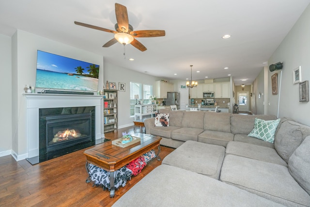 513 Abigail St, Moncks Corner, SC 29461 - living area with ceiling fan with notable chandelier, a fireplace with flush hearth, baseboards, dark wood-style floors, and recessed lighting