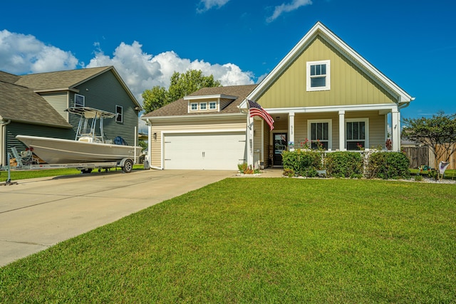 513 Abigail St, Moncks Corner, SC 29461 - craftsman house featuring board and batten siding, driveway, a garage, a front yard, and a porch