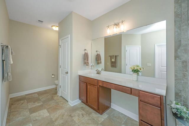 513 Abigail St, Moncks Corner, SC 29461 - full bathroom featuring stone finish floor, toilet, baseboards, visible vents, and vanity