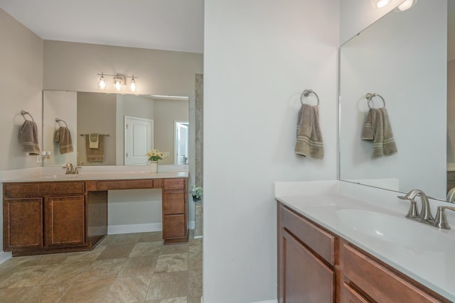 513 Abigail St, Moncks Corner, SC 29461 - bathroom featuring a sink, two vanities, baseboards, and stone finish flooring