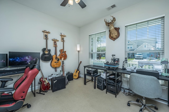 office area featuring ceiling fan and light carpet