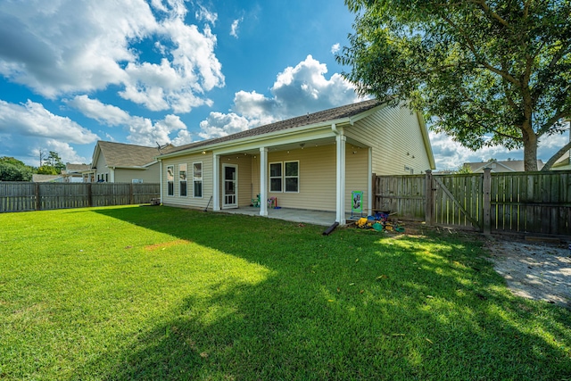 513 Abigail St, Moncks Corner, SC 29461 - rear view of house featuring a yard, a patio, a gate, and a fenced backyard