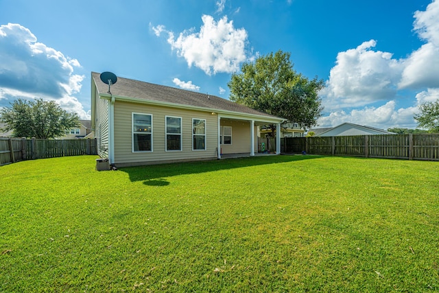 513 Abigail St, Moncks Corner, SC 29461 - back of house with a fenced backyard and a lawn