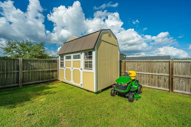 view of outbuilding featuring a yard