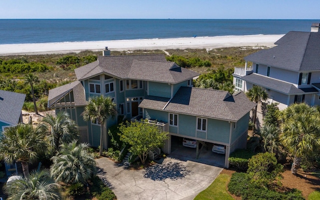 aerial view with a water view and a view of the beach