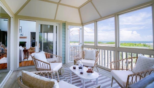 sunroom featuring vaulted ceiling