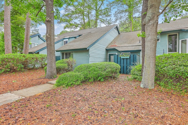 1115 Shadow Lake Cir, Mount Pleasant, SC 29464 - view of front of house with a shingled roof and fence