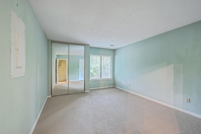 1115 Shadow Lake Cir, Mount Pleasant, SC 29464 - carpeted empty room featuring a textured ceiling, baseboards, and electric panel