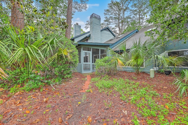 1115 Shadow Lake Cir, Mount Pleasant, SC 29464 - rear view of house featuring a chimney and a sunroom