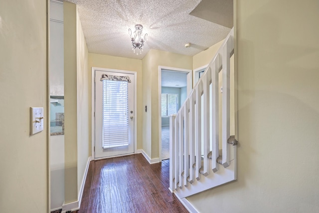 1115 Shadow Lake Cir, Mount Pleasant, SC 29464 - entryway featuring a chandelier, dark wood-style flooring, baseboards, and a textured ceiling