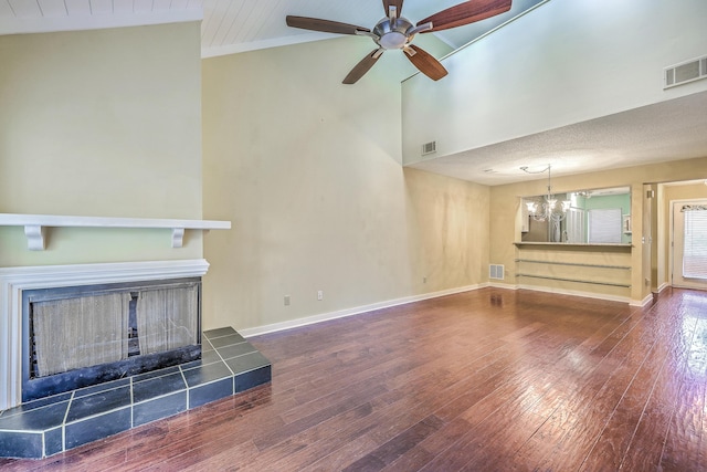 1115 Shadow Lake Cir, Mount Pleasant, SC 29464 - unfurnished living room featuring a chandelier, hardwood / wood-style flooring, a tiled fireplace, ceiling fan, and baseboards