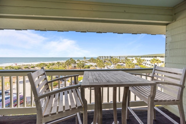 balcony with a view of the beach and a water view