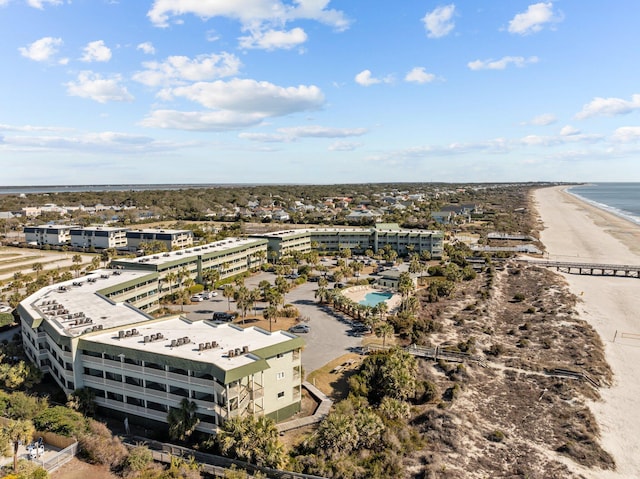 birds eye view of property featuring a view of the beach and a water view