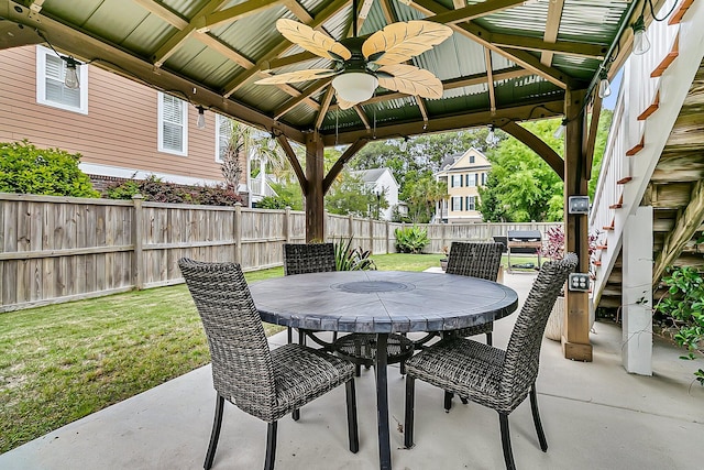 view of patio featuring ceiling fan, outdoor dining space, and a gazebo