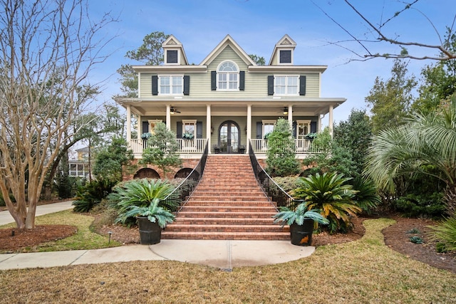 view of front facade featuring covered porch and a front lawn