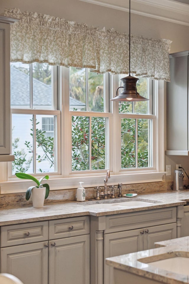 kitchen with white cabinetry and a sink