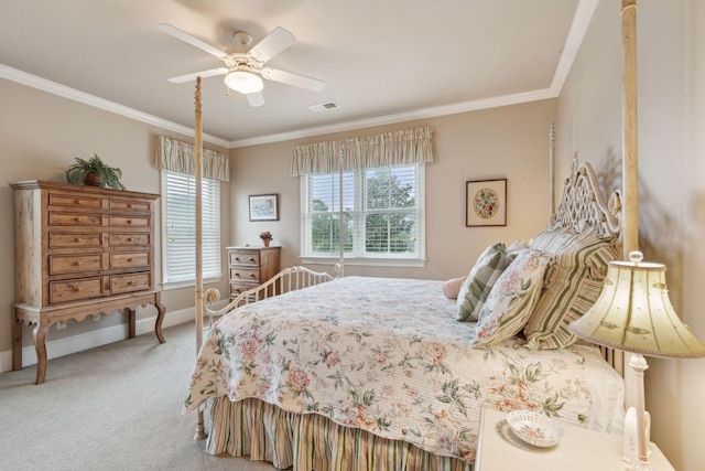 bedroom featuring baseboards, visible vents, a ceiling fan, crown molding, and carpet floors