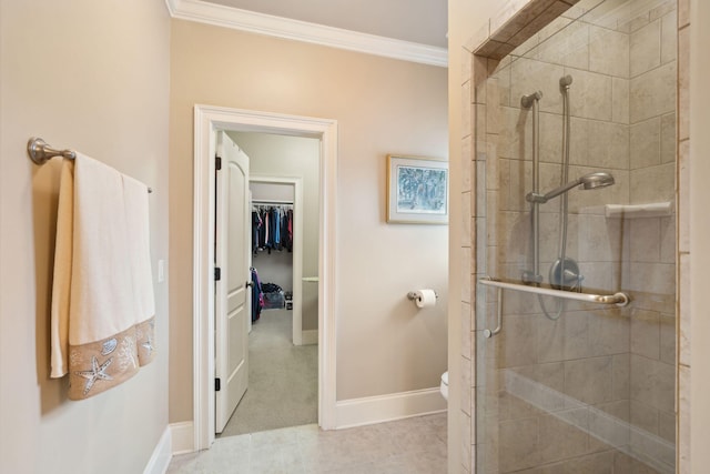 full bathroom with toilet, a stall shower, a spacious closet, and ornamental molding