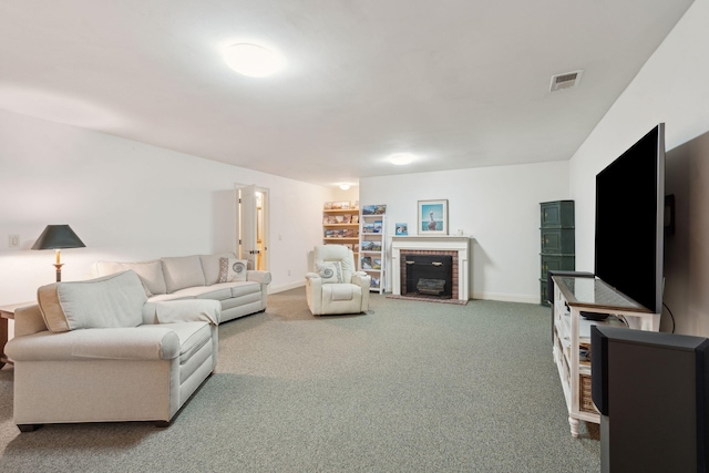 carpeted living area featuring a brick fireplace, visible vents, and baseboards