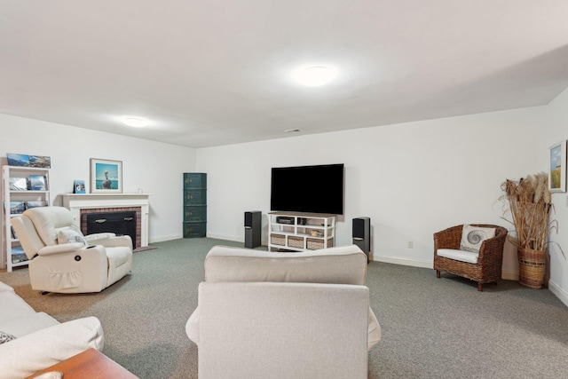 carpeted living area with a fireplace and baseboards