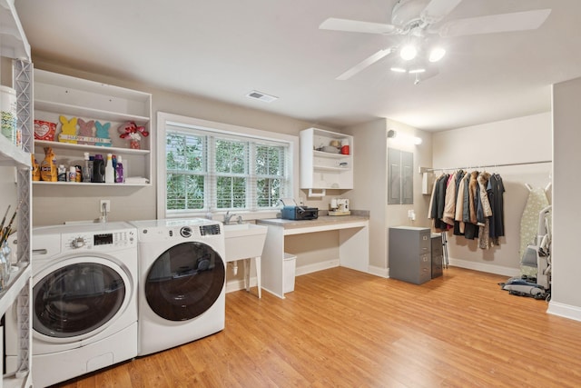 washroom featuring laundry area, light wood finished floors, visible vents, and washer and dryer