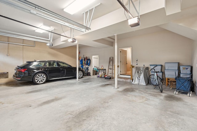 garage featuring a garage door opener