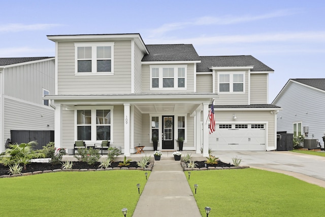 109 Medford St, Summerville, SC 29486 - view of front of home with covered porch, driveway, a front yard, a garage, and central AC unit