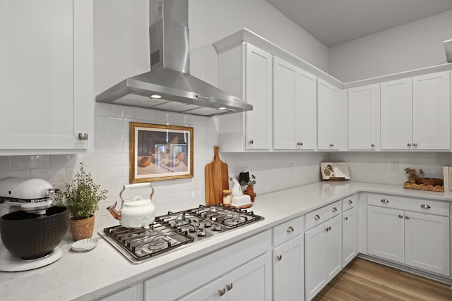 109 Medford St, Summerville, SC 29486 - kitchen with wall chimney range hood, stainless steel gas stovetop, light countertops, and white cabinetry