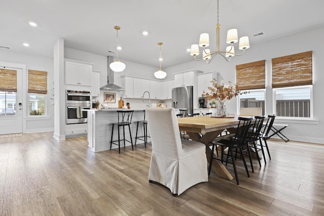 109 Medford St, Summerville, SC 29486 - dining area featuring a chandelier, recessed lighting, light wood-style floors, and baseboards