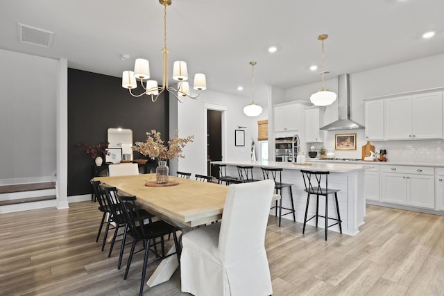109 Medford St, Summerville, SC 29486 - dining room with light wood-style flooring, recessed lighting, a chandelier, and baseboards