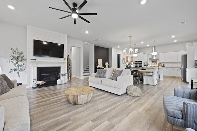109 Medford St, Summerville, SC 29486 - living area featuring recessed lighting, ceiling fan, light wood-style flooring, stairs, and a fireplace