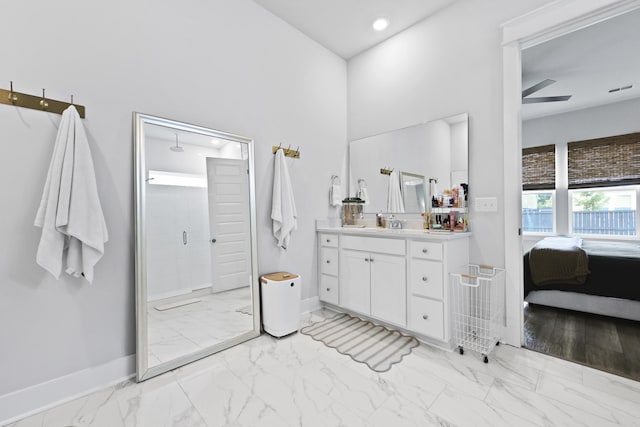 109 Medford St, Summerville, SC 29486 - bathroom featuring marble look tile flooring, vanity, a shower stall, baseboards, and a high ceiling