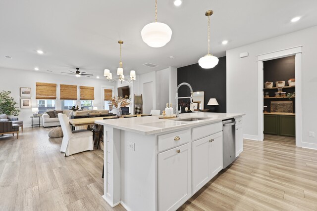 109 Medford St, Summerville, SC 29486 - kitchen with a sink, stainless steel dishwasher, light countertops, a kitchen island with sink, and a chandelier