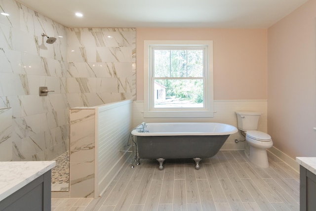 708 S Laurel St, Summerville, SC 29483 - full bath with tile walls, a freestanding tub, vanity, wood finished floors, and walk in shower