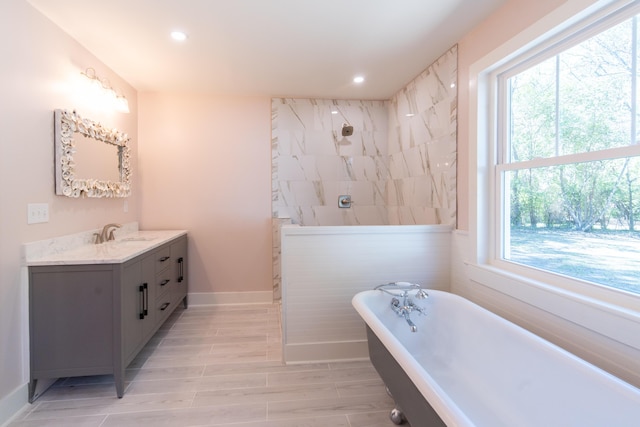 708 S Laurel St, Summerville, SC 29483 - bathroom featuring a freestanding tub, vanity, plenty of natural light, and walk in shower
