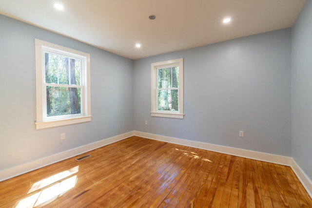 708 S Laurel St, Summerville, SC 29483 - empty room with hardwood / wood-style flooring, baseboards, visible vents, and a wealth of natural light