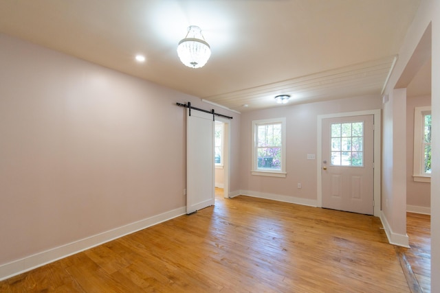 708 S Laurel St, Summerville, SC 29483 - interior space with baseboards, light wood finished floors, and a barn door