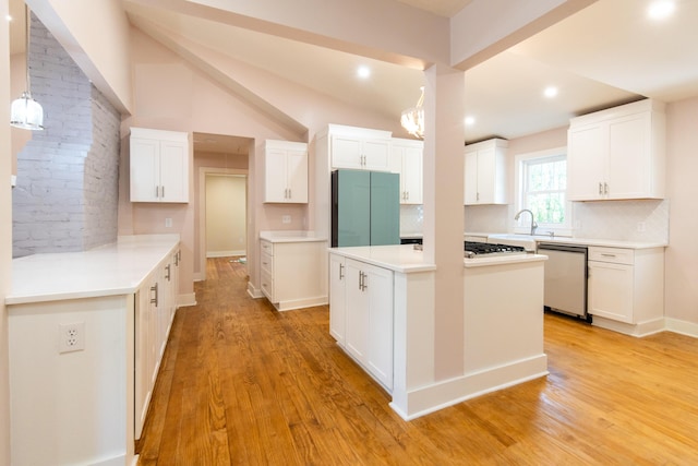 708 S Laurel St, Summerville, SC 29483 - kitchen with a center island, freestanding refrigerator, stainless steel dishwasher, light wood-style flooring, and decorative backsplash
