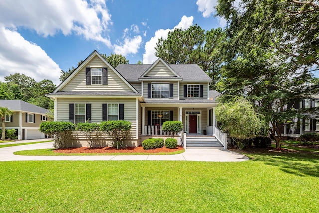 477 Commonwealth Rd, Mount Pleasant, SC 29466 - view of front of property featuring covered porch, a front lawn, and a shingled roof