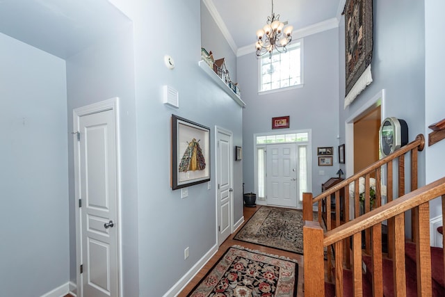 477 Commonwealth Rd, Mount Pleasant, SC 29466 - foyer featuring a chandelier, ornamental molding, stairs, wood finished floors, and a towering ceiling