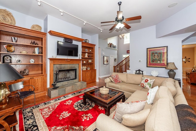 477 Commonwealth Rd, Mount Pleasant, SC 29466 - living area featuring track lighting, wood finished floors, a ceiling fan, a fireplace, and stairs