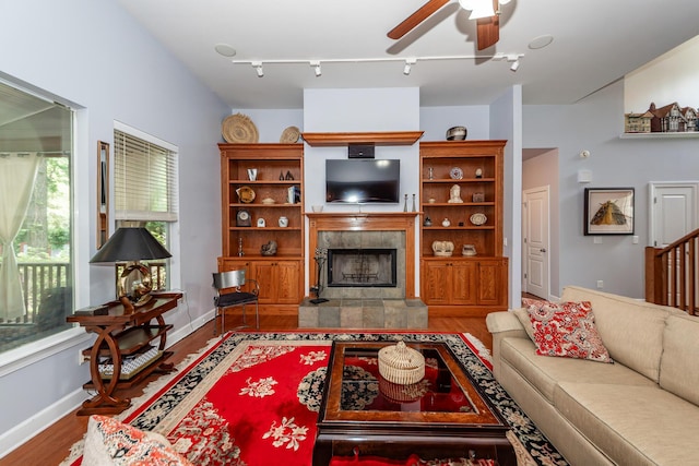 477 Commonwealth Rd, Mount Pleasant, SC 29466 - living area with a tiled fireplace, wood finished floors, a ceiling fan, and track lighting