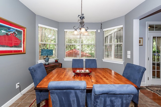 477 Commonwealth Rd, Mount Pleasant, SC 29466 - dining room featuring baseboards and a chandelier