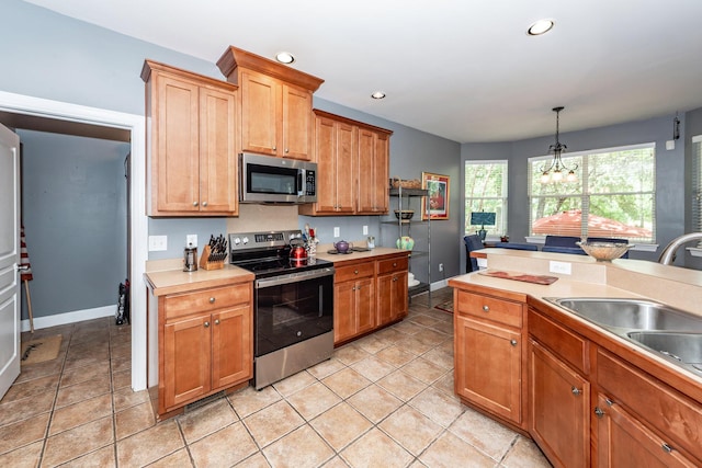 477 Commonwealth Rd, Mount Pleasant, SC 29466 - kitchen featuring stainless steel appliances, light countertops, a chandelier, recessed lighting, and pendant lighting