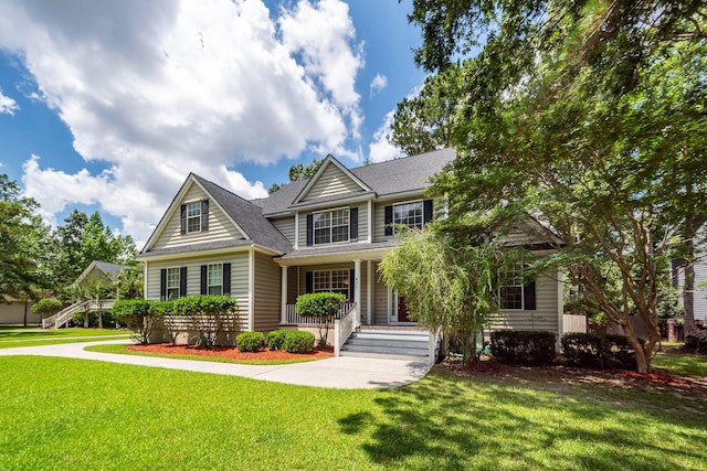 477 Commonwealth Rd, Mount Pleasant, SC 29466 - view of front of home featuring a porch, a front lawn, a shingled roof, and stairs