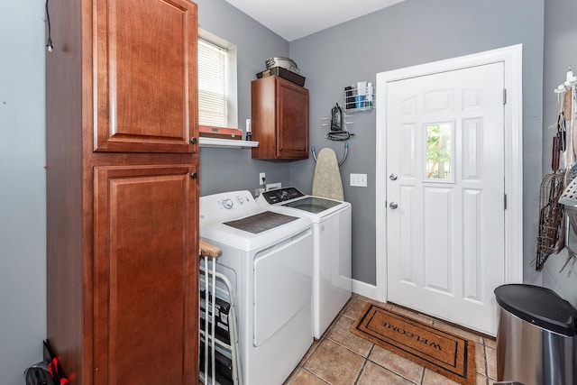 477 Commonwealth Rd, Mount Pleasant, SC 29466 - laundry area featuring cabinet space, washer and clothes dryer, and light tile patterned floors